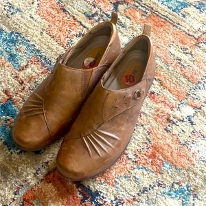 Brown shoes by earth